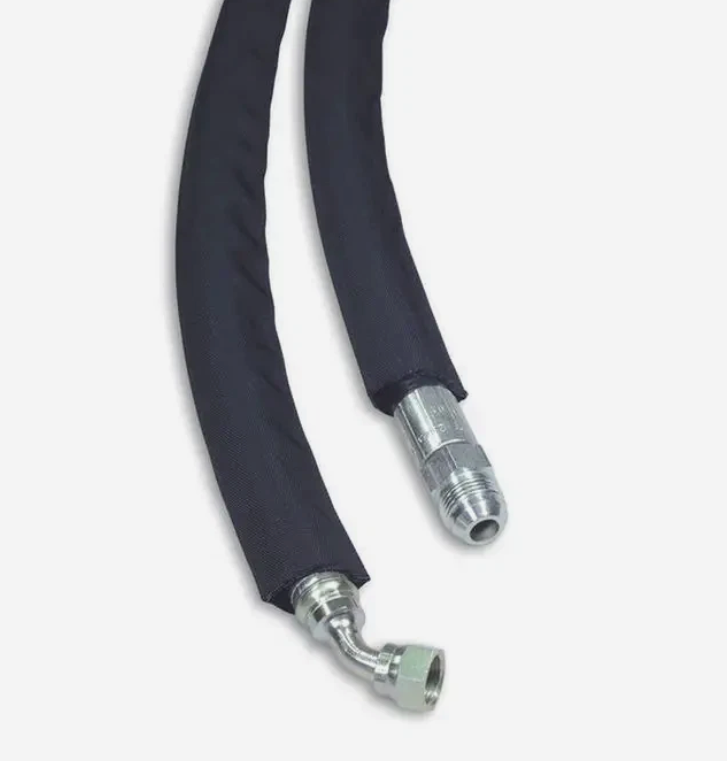 Hydraulic hose covered in black protective wrap with fittings